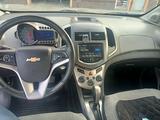 Chevrolet Aveo 2013 года за 3 800 000 тг. в Караганда – фото 4